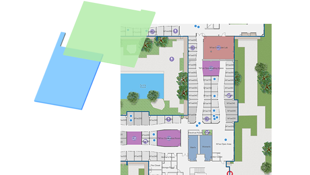 Indoor map with blue dots and data being managed in a GIS for a large building, with colored shapes.
