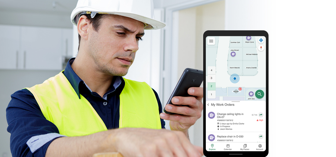 Maintenance worker in a hard hat and yellow vest using a cell phone next to an inset image of a cell phone showing a map 