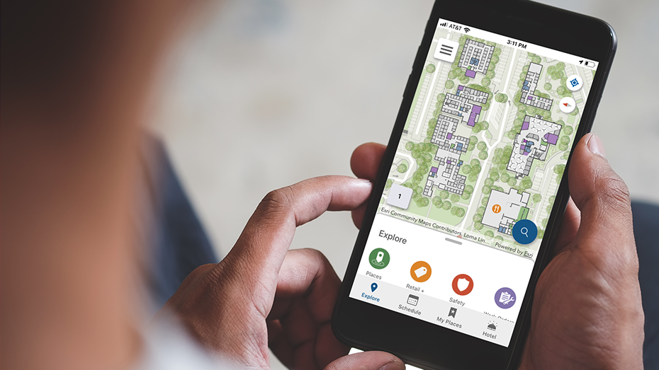 Person viewing indoor map of office building on a mobile phone,Person viewing indoor map of office building on a mobile phone