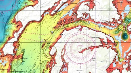 A colorful navigation chart overlaid with compass markings