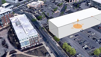 A digital twin of an urban city showing how a new building could cast shadows on a baseball field