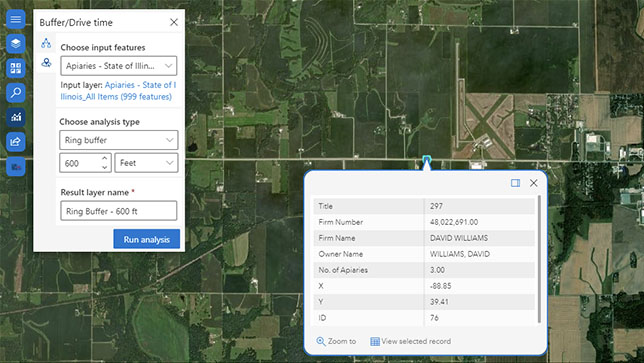 Satellite image with green land and two white popup boxes with text representing a buffer drive layer and feature selection,Satellite image with green land and two white popup boxes with text representing a buffer drive layer and feature selection