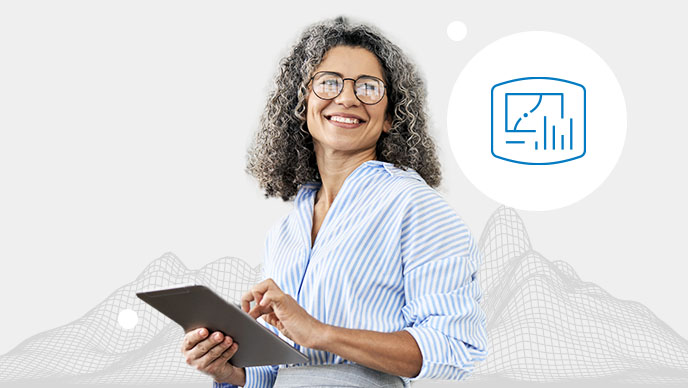 A smiling woman with a blue striped top typing on a tablet with an inset icon of a bar graph