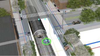 Aerial view of a crossroad in a 3D visualization, with gray shaded road sections and a green circle around a specific point