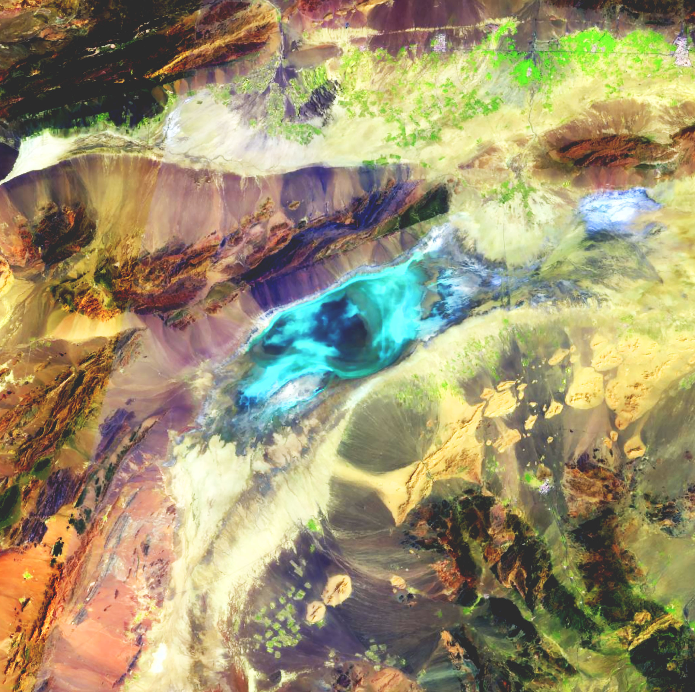 Remote sensing satellite imagery shows a landscape with blue, purple, pink, and yellow gradients surrounding terrain textures