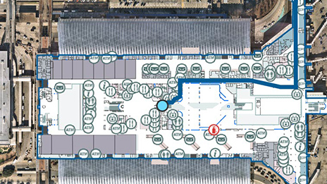 Indoor map of an airport facility showing the blue dot of current location and scattered round data points in an aerial view