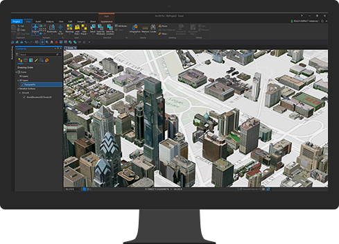 A computer monitor displays a computer-generated 3D city map
