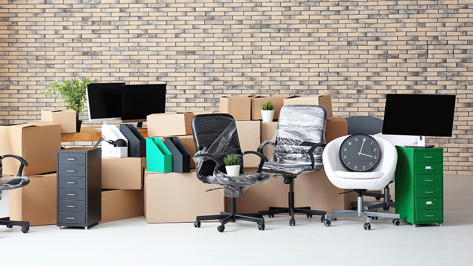 Office equipment including two chairs, 2 monitors, 2 filing cabinets and several packed boxes 