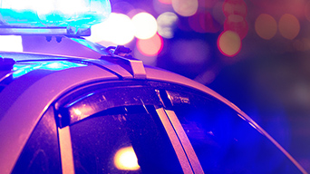 Police car with blue flashing siren