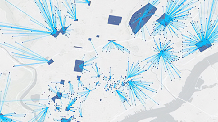 Gray map with blue squares representing buildings and blue starburst lines shooting out with circles at the end