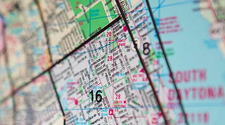 A map of South Daytona with pink and black boundary lines and large numbers representing a redistricting map