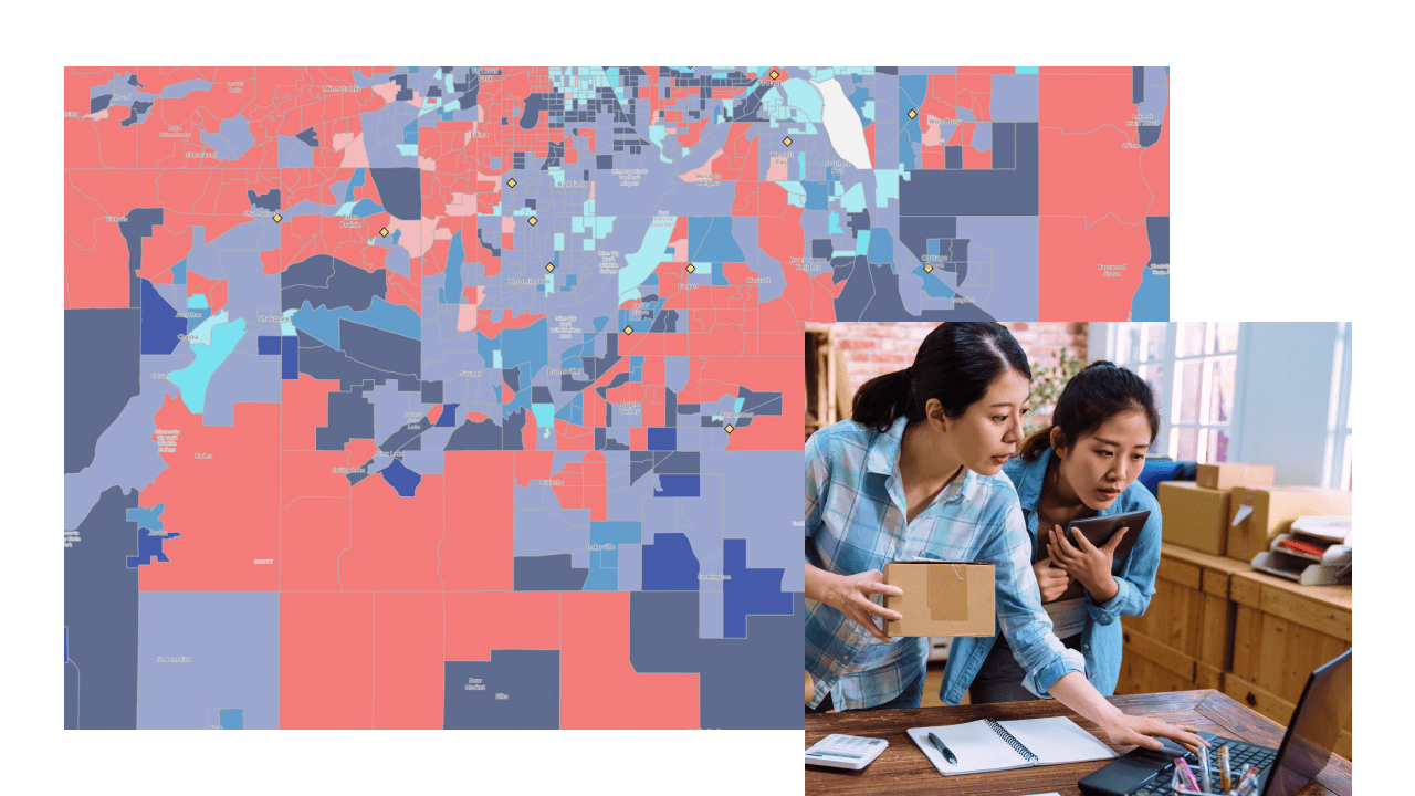 A city map shaded in pink and blue on a violet background, overlaid with a photo of two casually dressed people leaning over a computer display in a home office