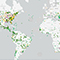 A map of most of the world with many differently colored dots dispersed across continents