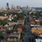 An urban residential neighborhood with a city skyline in the background 