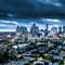 The Houston skyline at dusk under a cloudy sky