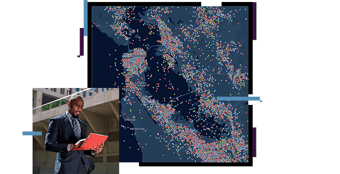 Man looking at a laptop, map with densely placed dots