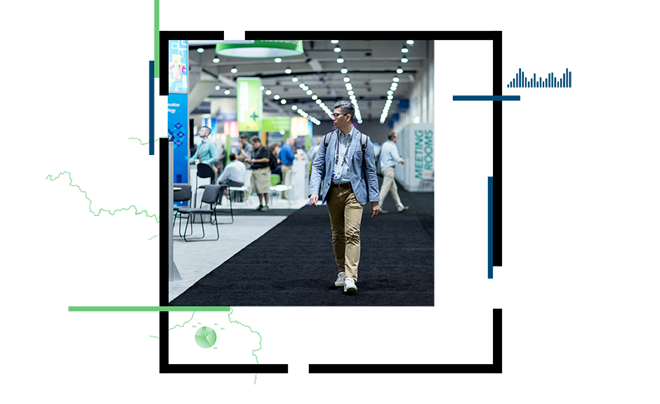 Person walking thorough conference exhibit hall