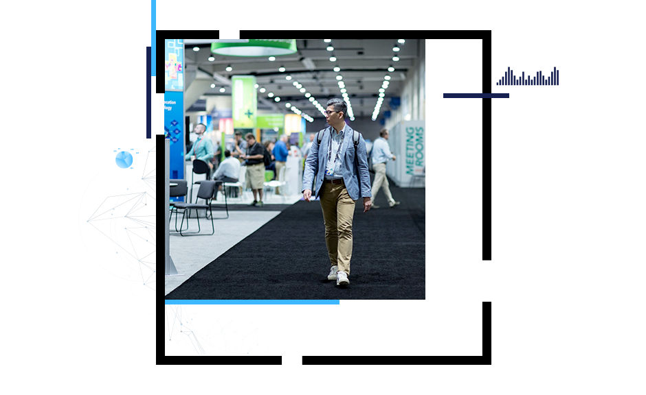 Person walking in conference showcase area