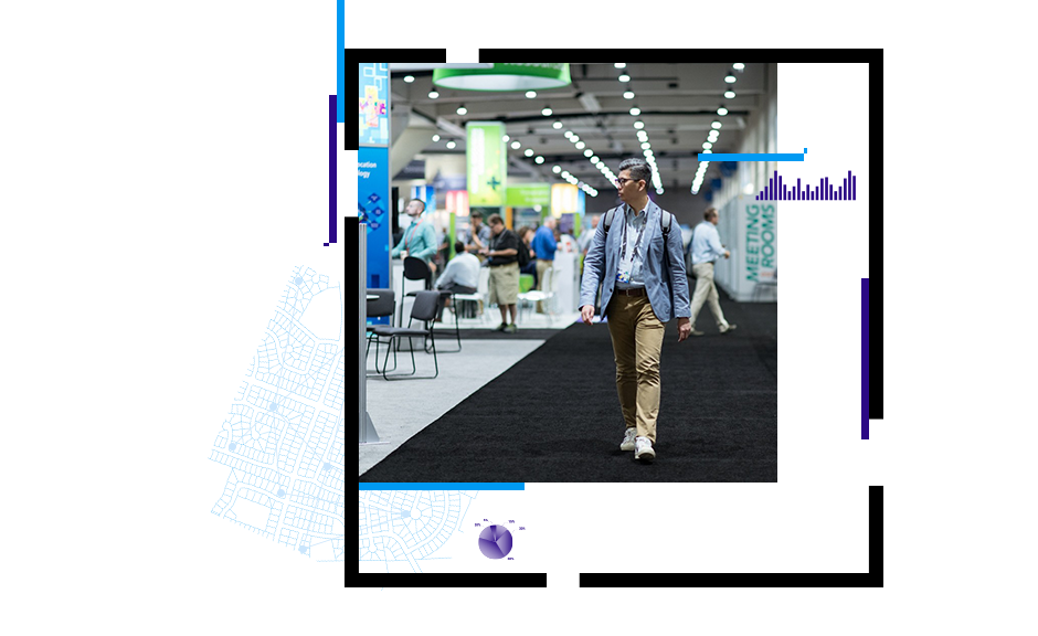 person walking through a conference hall