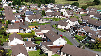 A bird’s eye view of a densely developed area with many white buildings