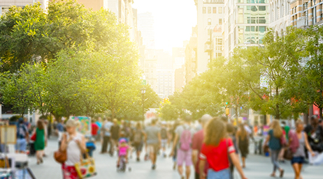 A view of a crowd walking in a city