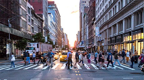 Large group of people walking in a crosswalk