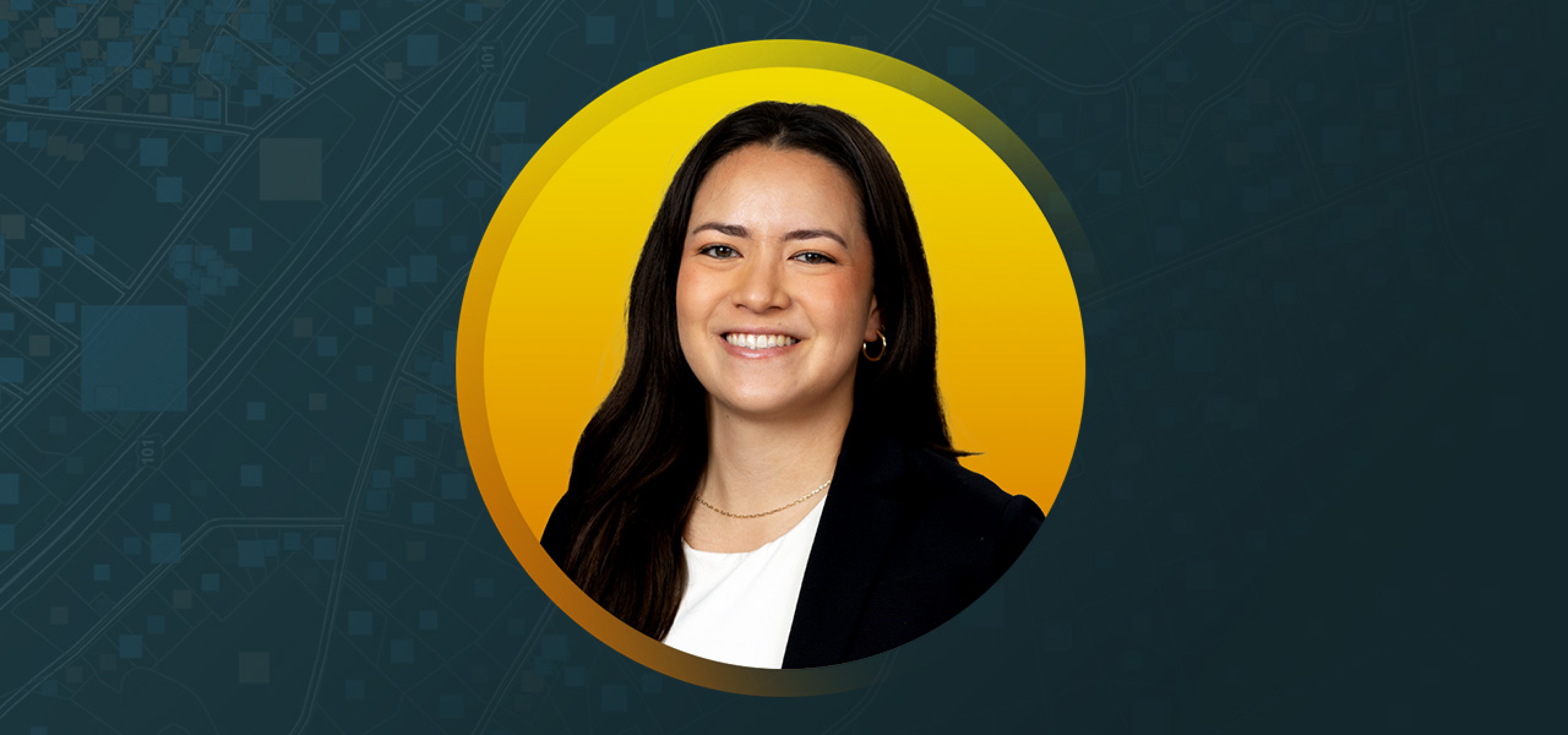 Olivia Godfrey smiling and wearing a white shirt and black blazer on a yellow and blue abstract background
