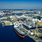 A loading dock at a coastal port overlaid with many interconnected white dots