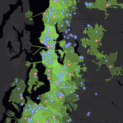 Map of Seattle, Washington, with green areas and blue and red dots indicating customer-centric analysis