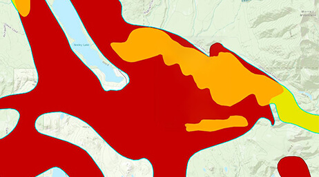 A contour map with areas shaded in red and orange on a beige background
