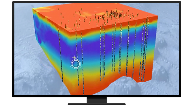 A monitor displaying a yellow, orange, green, and blue 3D layer