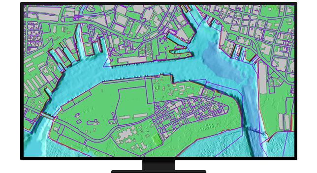 A monitor displaying a green map with purple outlines