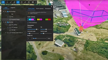 A screencap from the featured webinar with an aerial image of a rural setting overlaid with terrain data and analytics menus