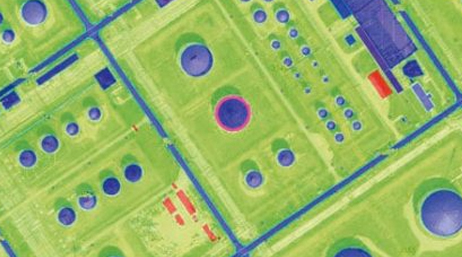 A contour map of an industrial facility in lime green and purple