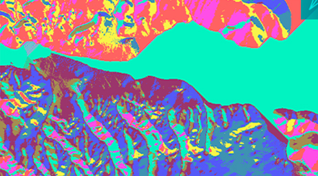 An aerial view of a body of water decreasing into a small waterway flanked by land and shaded many neon colors