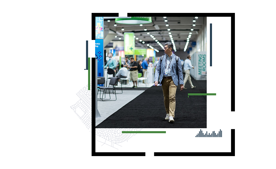 Two event attendees signing up for usability research at computers, and an Esri User Conference attendee walking through the Expo