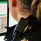 A person working at a desktop computer displaying ArcGIS Maps for Office