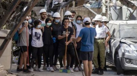 A group of search and rescue volunteers in hard hats standing together
