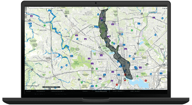 A laptop displaying a map with a shaded area indicating a potential impacted area