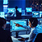 An emergency operation room with people working at desktop computers monitoring situations