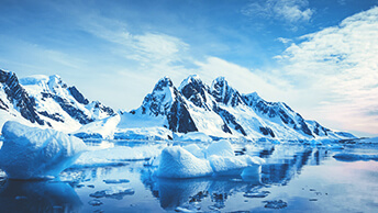 Arctic landscape with snow-covered mountains and a waterway