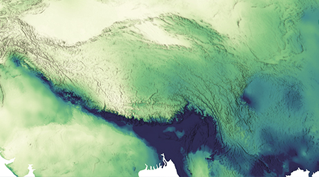 A satellite view of land shaded in greens and blues