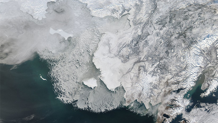 A black and white satellite image of sea ice