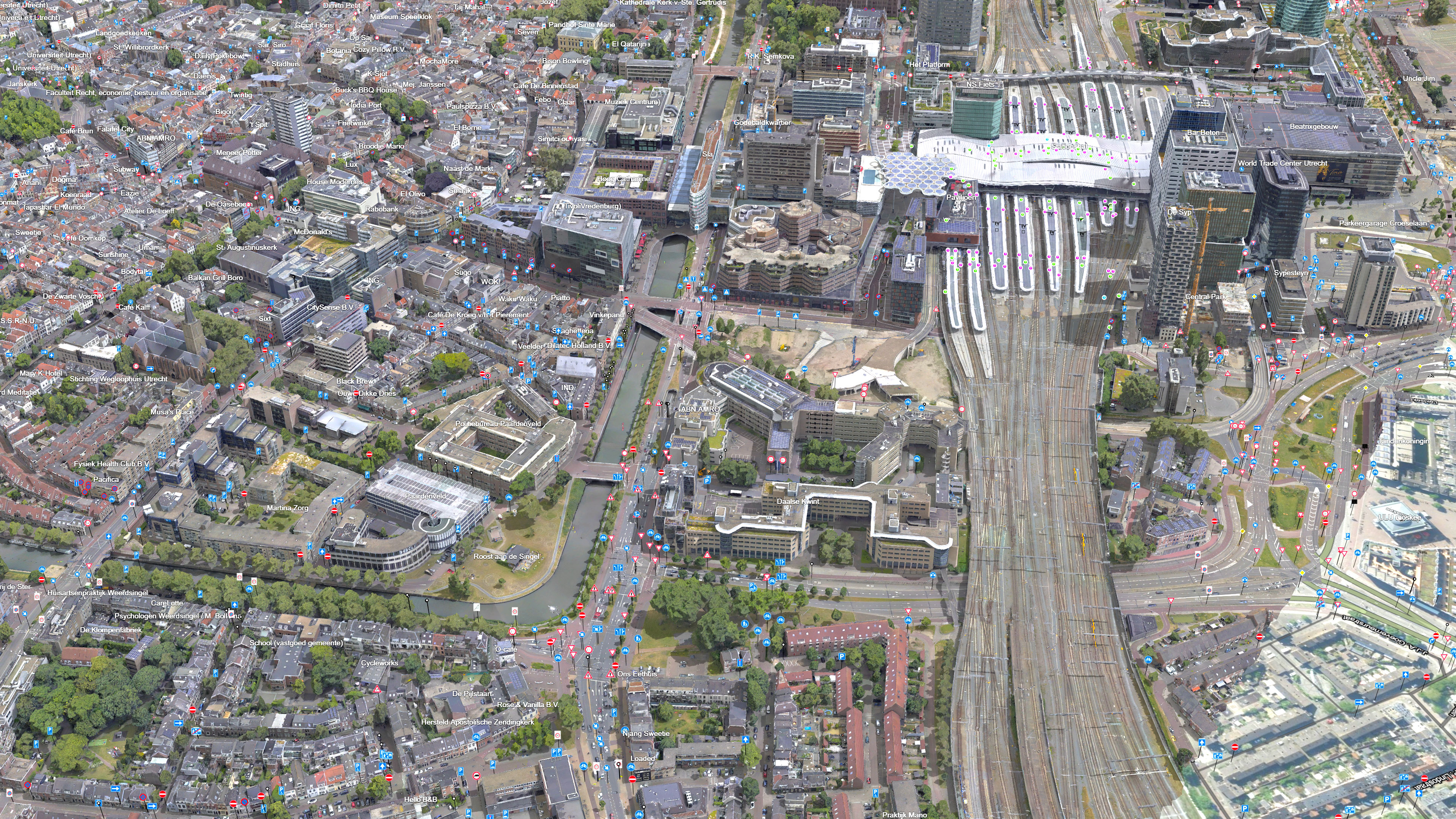 Aerial view of city showing streets, homes, trees