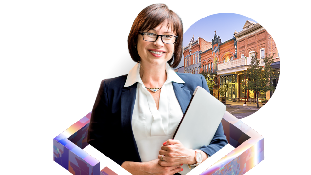 Person smiling while holding a laptop, alongside a map, colorful map hexagons, and a picture of a building