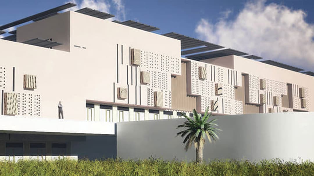 Panned out view of buildings showing landscape outside of building complex